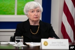 FILE - Treasury Secretary Janet Yellen listens during a meeting on the White House campus, Oct. 6, 2021.