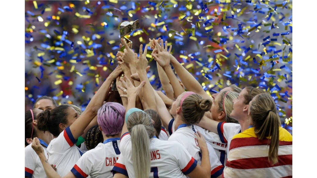 The U.S. team celebrates with the trophy after winning the Women's World Cup final soccer match between US and the Netherlands, at the Stade de Lyon, in Decines, outside Lyon, France, July 7, 2019.