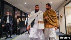 Taliban representatives walk at the Soria Moria Hotel where they are taking part in closed-door talks, in Oslo, Norway, Jan. 23, 2022. (NTB/Torstein Boe via Reuters)