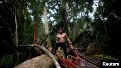 FILE - An indigenous man called Tebu, of the Uru-eu-wau-wau tribe, looks on in an area deforested by invaders in the village of Alto Jaru, at the Uru-eu-wau-wau Indigenous Reserve near Campo Novo de Rondonia, Brazil, Feb. 1, 2019.