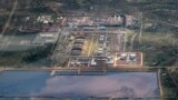 In this photo taken Sept. 27, 2018, a reservoir of polluted water next to an oil field is seen from the air in Palouch, South Sudan.