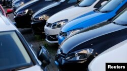 FILE - Volkswagen cars are seen at a dealership in London, Great Britain, Sept. 30, 2015.