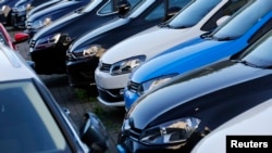 FILE - Volkswagen cars are seen at a dealership in London, Great Britain, Sept. 30, 2015.