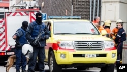 Armed police guard a street in Brussels on Nov. 16, 2015.