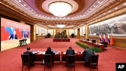 Переговори по відеозв'язку президента Росії Володимира Путіна та лідера Китаю Сі Цзіньпіна, 30 грудня 2022. Shen Hong/Xinhua via AP
