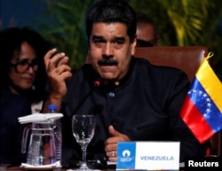 FILE - Venezuela's President Nicolas Maduro speaks at the IV Gas Exporting Countries Forum in Santa Cruz, Bolivia, Nov. 24, 2017.