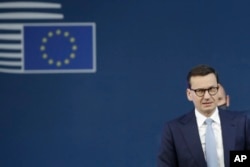 FILE - Poland's Prime Minister Mateusz Morawiecki arrives for an EU summit in Brussels, Oct. 22, 2021.