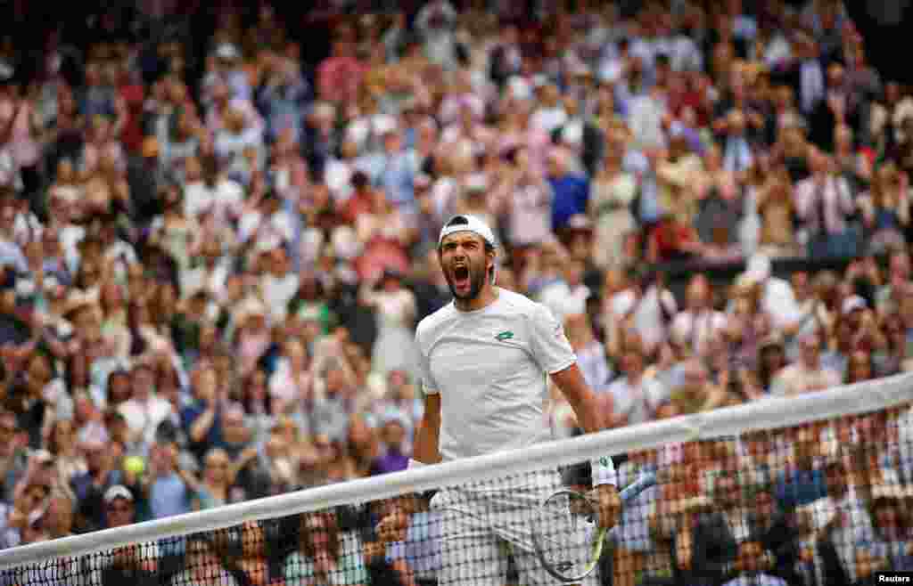 Italy&#39;s Matteo Berrettini celebrates after defeating Poland&#39;s Hubert Hurkacz during the men&#39;s singles semifinals match of the Wimbledon Tennis Championships in London.