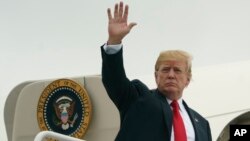 President Donald Trump waves as he boards Air Force One at Morristown Municipal Airport, in Morristown, N.J., July 22, 2018, en route to Washington after staying at Trump National Golf Club in Bedminster, N.J.