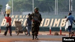 A Moroccan soldier from the peacekeeping forces secures a street in Bangui, Central African Republic, Feb. 20, 2014.