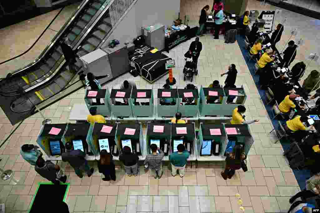 People vote at a polling station at Meadows Mall in Las Vegas, Nevada, on Election Day, Nov. 5, 2024. 