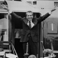 Richard Nixon says goodbye to staff members outside the White House on August 9, 1974, after resigning