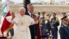 Pope Benedict XVI waves upon his arrival at Beirut international airport as he is welcomed by Lebanon's President Michel Suleiman, September 14, 2012. 