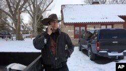 Ryan Bundy talks on the phone at the Malheur National Wildlife Refuge near Burns, Ore., Sunday, Jan. 3, 2016. 
