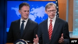 FILE - Brian Hook (R), U.S. Special Representative for Iran, and Ambassador Nathan Sales (L), State Department Coordinator for Counterterrorism, speak during a press conference at the State Department in Washington, DC, April 8, 2019. 