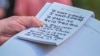 U.S. President Donald Trump reads from his notes as he speaks to reporters on the South Lawn of the White House in Washington before departing for Austin, Texas.