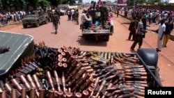 Armed Seleka rebel alliance fighters patrol streets in pickup trucks to stop looting, Bangui, Central African Republic, March 26, 2013.