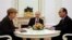 La canciller alemana, Angela Merkell, junto al presidente ruso, Vladimir Putin, y el mandatario francés, François Hollande. 
