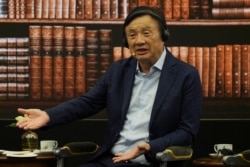 FILE - Huawei founder Ren Zhengfei speaks during a roundtable at the telecom giant's headquarters in Shenzhen, China, June 17, 2019. Huawei's founder says revenues will be $30 billion less than forecast over the next two years.