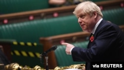Britain's Prime Minister Boris Johnson speaks during the weekly question-time debate at the House of Commons in London, Britain, Nov. 11, 2020. 