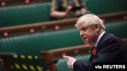 FILE - Britain's Prime Minister Boris Johnson speaks during the weekly question-time debate at the House of Commons in London, Britain, Nov. 11, 2020.