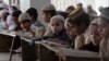 Pakistani children attend lessons at a madrassa, or a religious school, to learn Quran, in Karachi, Sept. 2, 2015. 
