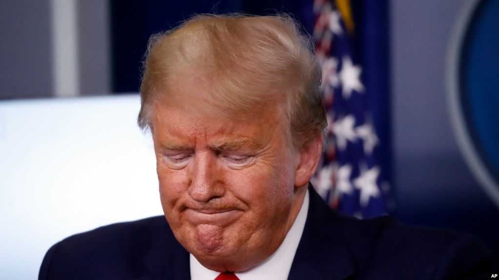 President Donald Trump pauses during a briefing about the coronavirus in the James Brady Press Briefing Room of the White House, March 31, 2020, in Washington. 