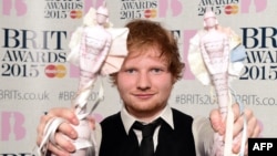 FILE - British singer-songwriter Ed Sheeran poses with his British album of the year award for 'X' and his British male solo artist award at the BRIT Awards 2015 in London, Feb. 25, 2015. 