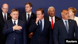 British Prime Minister David Cameron (C) stands amongst other European leaders at the EU Summit in Brussels, Belgium, June 28, 2016.
