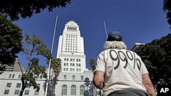 Occupy LA protester Mike Oren, of Bowling Green, Ohio, stands outside Los Angeles City Hall in Los Angeles, October 27, 2011.