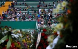 Fans of Brazil's Chapecoense soccer team wait before a ceremony mourning the victims after the plane carrying the team crashed in Colombia, at Arena Conda stadium in Chapeco, Brazil, Dec. 2, 2016.