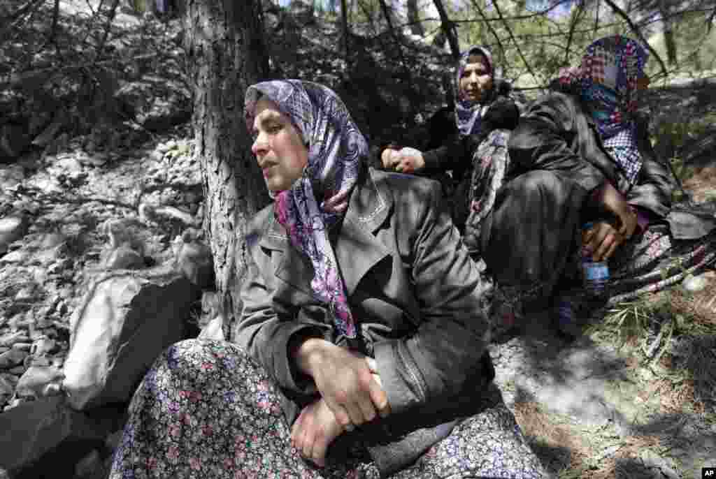 Relatives of the miners wait near the coal mine where disaster struck, in Soma, western Turkey, Thursday, May 15, 2014.