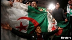 People celebrate on the streets after Algeria's President Abdelaziz Bouteflika has submitted his resignation, in Algiers, Algeria April 2, 2019. REUTERS/Ramzi Boudina