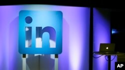 FILE - The LinkedIn logo is displayed during a product announcement in San Francisco, Sept. 22, 2016.