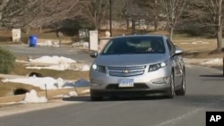 Lawyer Jeff Parmet, behind the wheel of his Volt, says he hasn't pumped gas since buying the electric car in December.