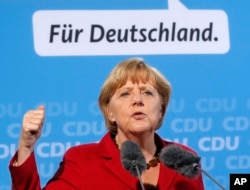 German Chancellor and CDU top candidate Angela Merkel speaks during an election campaign meeting in Giessen, Germany, Sept.4, 2013.
