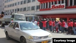 Some police officers were also stoned by the protestors in retaliation, resulting in several shop owners closing their businesses. (Photo: MDC-T website)