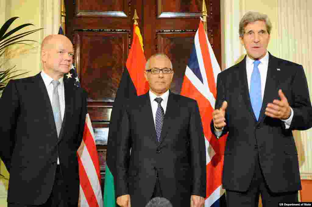 U.S. Secretary of State John Kerry speaks as he is joined by British Foreign Secretary William Hague and Libyan Prime Minister Ali Zeidan following a trilateral meeting in London, United Kingdom, on November 24, 2013.