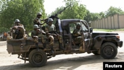 FILE - Niger soldiers provide security for an anti-Boko Haram summit in Diffa city, Niger, Sept. 3, 2015. Niger said Nov. 5, 2015, it had bombed a Boko Haram base in the country's southeast and arrested more than 20 militants.