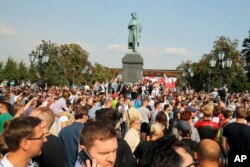 FILE - Protesters rally in Moscow, Sept. 9, 2018. Opponents of a Russian government move to increase the age for collecting state retirement pensions are holding protests throughout the country and scattered arrests have been reported.