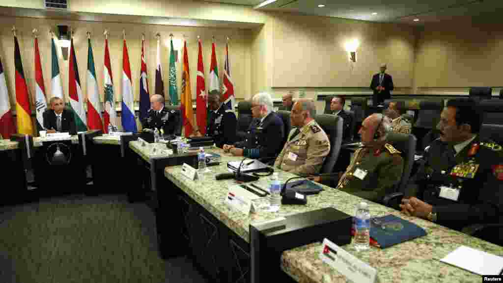 U.S. President Barack Obama speaks at a meeting with more than 20 foreign defense chiefs to discuss the coalition efforts in the ongoing campaign against Islamic State militants at Joint Base Andrews in Washington, Oct. 14, 2014. 