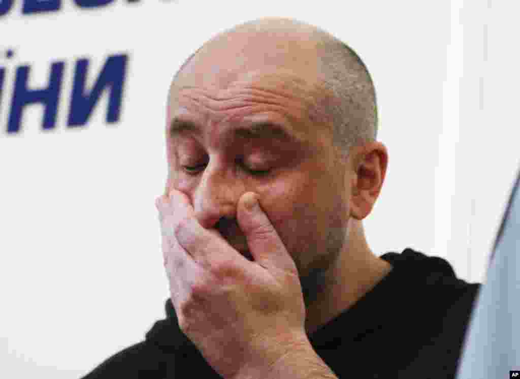 Russian journalist Arkady Babchenko reacts during a news conference at the Ukrainian Security Service in Kyiv. Babchenko turned up at a news conference in the Ukrainian capital less than 24 hours after police reported he had been shot and killed at his Kyiv apartment building. The country's security services said Babchenko's death was faked to foil a plot to take his life.