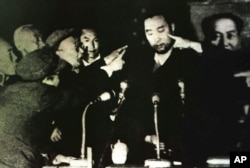 FILE - Tibet's 10th Panchen Lama is seen undergoing a Cultural Revolution struggle session in Tibet's capital Lhasa, in this 1964 photo.