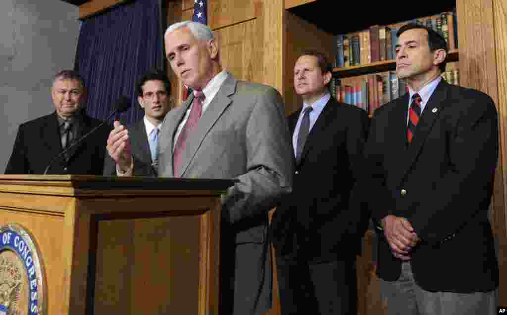 Rep. Mike Pence, center, speaks during a news conference on Iran, on Capitol Hill in Washington, D.C., June 19, 2009.