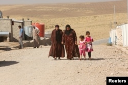 Displaced people, who fled Mosul, are living at a refugee camp in Duhok, Iraq, Oct. 16, 2016.