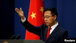 FILE - Chinese Foreign Ministry spokesperson Zhao Lijian attends a news conference in Beijing, China Sept. 10, 2020.