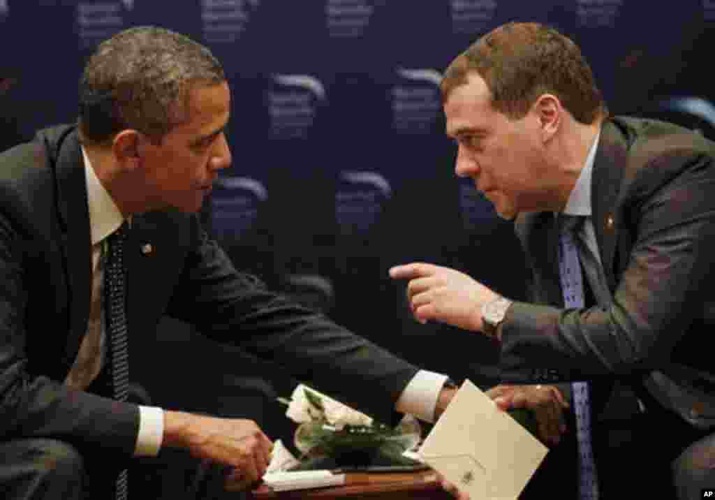 U.S. President Barack Obama, left, chats with Russian President Dmitry Medvedev during a bilateral meeting at the Nuclear Security Summit in Seoul, South Korea, Monday, March, 26, 2012. (AP Photo/Pablo Martinez Monsivais)