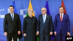 FILE - Estonia's Prime Minister Juri Ratas (L), Lithuania's President Dalia Grybauskaite (2-L) and Latvia's Prime Minister Maris Kucinskis (R) are seen with European Commission President Jean-Claude Juncker (2-R) at the start of a summit of European Union (EU) leaders in Brussels, Belgium, March 22, 2018.