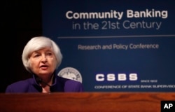 FILE - Federal Reserve Chair Janet Yellen delivers opening remarks during a community banking conference, Oct. 4, 2017, at the Federal Reserve Bank of St. Louis.