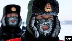 Chinese paramilitary police border guards train in the snow at Mohe County in China's northeast Heilongjiang province, on the border with Russia, Dec. 12, 2016. 